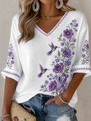 Damen-T-Shirt in Lila mit Blumen- und Kolibri-Print, halblangen Ärmeln und V-Ausschnitt – Unterstützung für das Bewusstsein rund um die Alzheimer-Krankheit