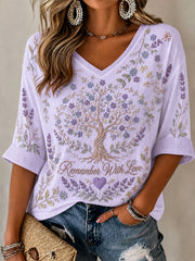 Frauen-T-Shirt mit dem Alzheimer-Motto „Erinnere dich mit Liebe“ und floralem Print – lässiger Style
