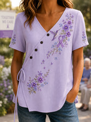 Damen-Shirt mit violetter Blumen- und Kolibri-Print-Aufmachung zur Sensibilisierung für die Alzheimer-Krankheit, V-Ausschnitt