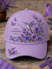 Unisex-Mütze in Lila mit Blumen- und Kolibri‑Muster zur Sensibilisierung für die Alzheimer‑Krankheit