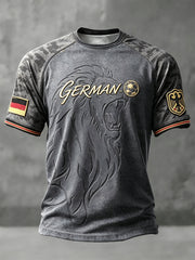 Herren-T-Shirt in Grau, Freizeitstil, mit Camouflage-Patchwork-Print und deutschem Fußball-Löwenmotiv
