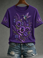 Damen-T-Shirt mit kurzem Ärmel und lila Blumen- sowie Kolibri-Print zur Sensibilisierung für die Alzheimer-Krankheit