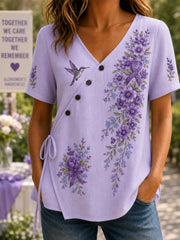 Damen-Shirt mit violetter Blumen- und Kolibri-Print-Aufmachung zur Sensibilisierung für die Alzheimer-Krankheit, V-Ausschnitt