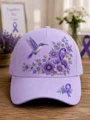 Unisex-Mütze in Lila mit Blumen- und Kolibri‑Muster zur Sensibilisierung für die Alzheimer‑Krankheit