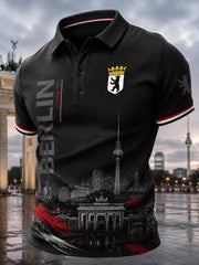 Herren-Poloshirt mit kurzen Ärmeln und urbanem, erinnerungsträchtigem Grafikdruck