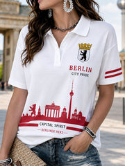 Damen-Poloshirt mit kurzen Ärmeln und grafischem Städte-Souvenir-Print